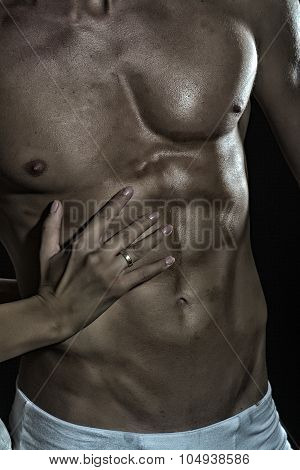 Muscular Man And Female Hand