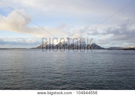 View of a Norwegian fjord with snowy mountains Nordland Norway