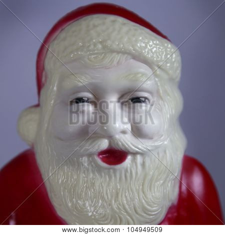 Close up of a vintage plastic Santa Claus Christmas decoration - Instagram filtered