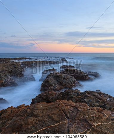 Sunset over the rocks at Shaws Cove in Laguna Beach