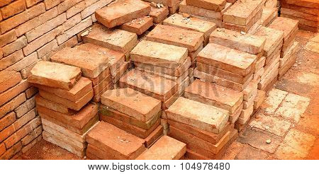 pile of red clay bricks