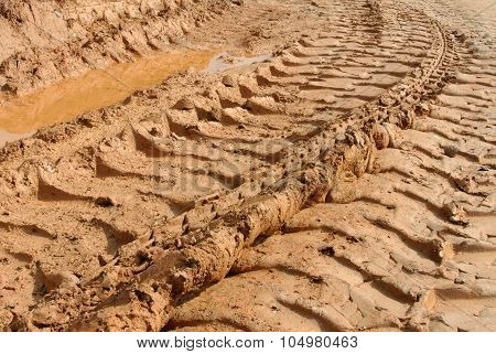 Tyre tracks or trail on soft soil.