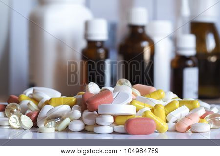 Colorful pills on background of bubbles