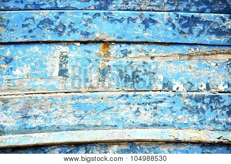 Stripped Paint In The Blue And Rusty Nail
