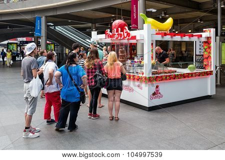 People Waiting For Sweets Kiosk At Central Station Antwerp, Belgium