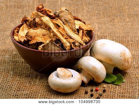 Mushrooms, Ceps And Raw Champignons On The Sacking Background