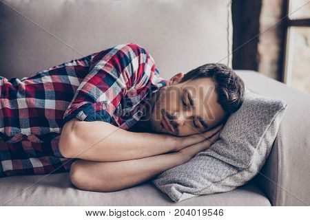 Sweet Dreams. Close Up Portrait Of Young Cute Brunet Hipster With Bristle, Sleeping On The Cozy Beig