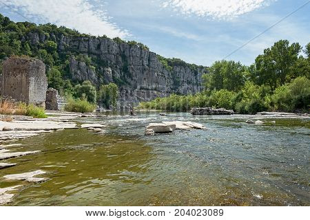 River Ardeche along the old village Vogue which village is recognized as historical heritage and is considered one of ten charming villages of France
