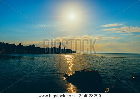 Sunset On The Seashore. City View Walk Along The Seafront