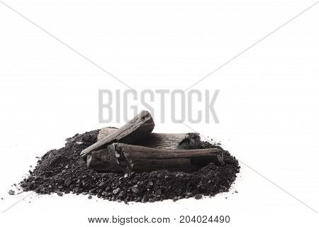 Charcoal and powder (activated carbon) on white background. Free space for text