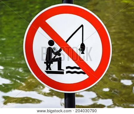 No fishing sign at the pond in the woods