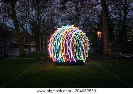 Amsterdam Netherlands - January 5 2017: Light Festival Amsterdam a multicolor art object in a park