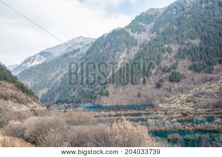 River landscape with mountains. Mountains in the background of a river. Forest mountains in the water