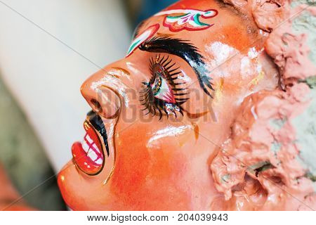 Artist preparing Clay idol of Asura the demon for 