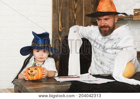Man And Boy On Wooden And White Brick Background