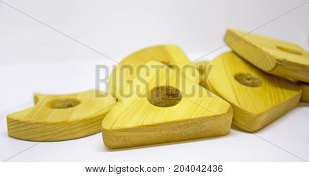 Handmade wooden pyramid toy with different shapes