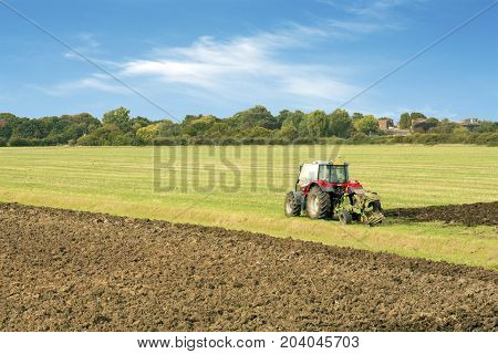 tractor ploughing a field tilbury essex uk