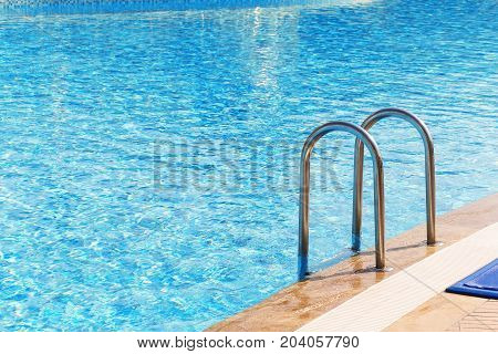 Blue Swimming Pool With Stair At Hotel