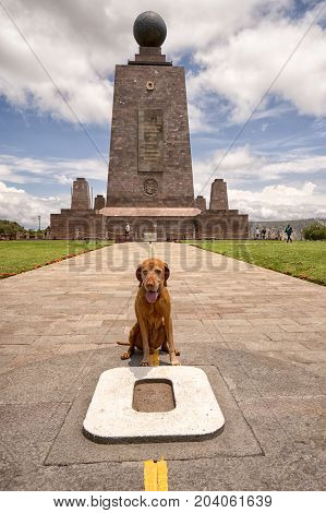 March 2 2017 Quito Ecuador: the monument marking the zero latitude in the Mitad del Mundo is dog friendly tourist destination