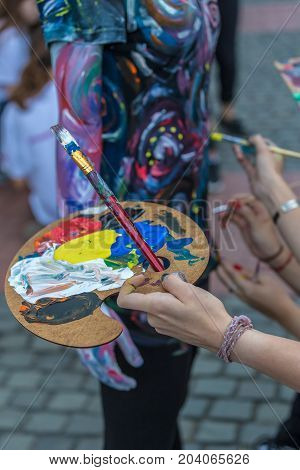 Body painting of a woman. 3D art symbolizing on live at the street inside the CheckART Carnival organized by the City Hall Timisoara. Liberty Square.