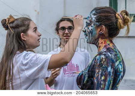 TIMISOARA ROMANIA - SEPTEMBER 8 2017: Face and body painting of a woman. 3D art symbolizing on live at the street inside the CheckART Carnival organized by the City Hall Timisoara. Liberty Square.