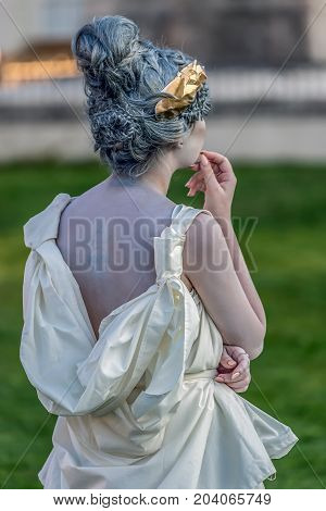 TIMISOARA ROMANIA - SEPTEMBER 8 2017: Living statue of a woman dressed with antical elements and present on the street inside the CheckART Carnival organized by the City Hall Timisoara. Union Square