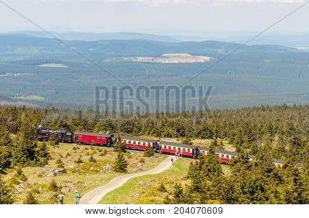 Brocken Germany - May 27. 2017: Steam train climping the tracks towards the top of Brocken Mountain