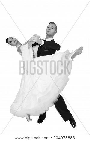 dance ballroom couple in a dance pose isolated on white background. sensual professional dancers dancing walz tango slowfox and quickstep. black and white