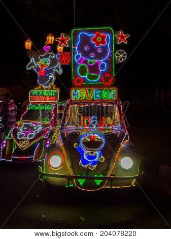 JOGJA, INDONESIA - AUGUST 12, 2O17: A traditional pedicap transport parket at outdoor with colorful and bright lights at night at jogja Yogyakarta Indonesia.