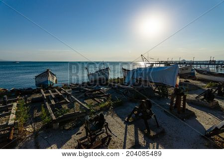 POMORIE BULGARIA - AUGUST 17 2017: Fishing boats on the shore. Seaport of the seaside town of Pomorie.