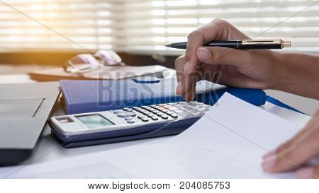 Businesswoman calculate about cost and doing finance at home office Finance managers task Concept business and finance investment