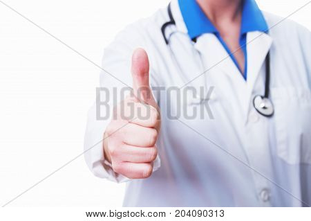 Female doctor giving a thumbs up isolated on white.
