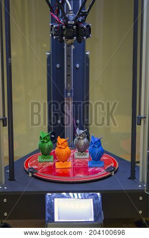 The models of owls in the 3d printer are three axial close-up. Progressive modern additive technologies 4.0 industrial revolution