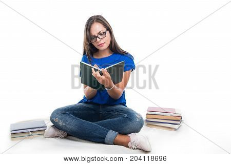 Beautiful Student Girl Sitting On Blanket Writing On Notebook