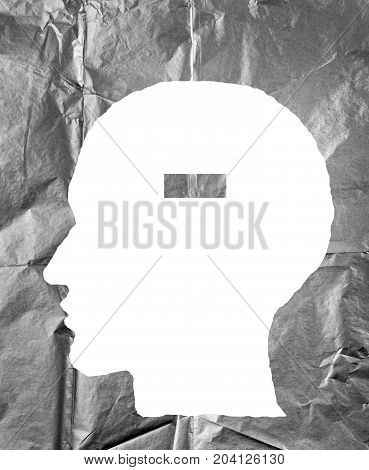 Crumpled paper shaped as a human head and minus sign. Negative and minus sign concept.