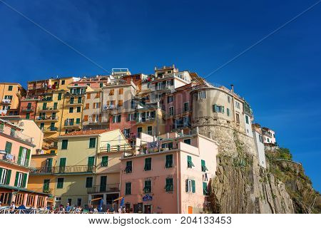 MANAROLA, ITALY - MAY 24, 2017: Magnificent daily view of the Manarola village in a sunny summer day. Manarola is one of the five famous villages in Cinque Terre (Five lands) National Park. Liguria, Italy, Europe