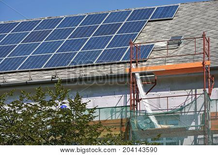 Solar panels on the roof of a building under construction
