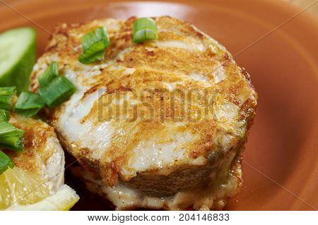 grilled t-bone codfish steak and vegetables  , close up traditional meal