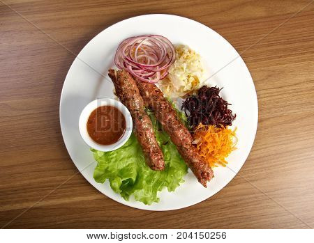 caucasian Luleh kebab with vegetable  , close up traditional meal