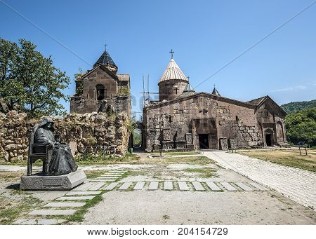 Armenia. The monastery complex Goshavank. Exterior with a monument to the founder of the monastery Mkhitar Gosh.