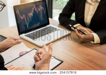 Finance trade manager showing reports screen analysis finance currency data on stock trade graph on business currency market.