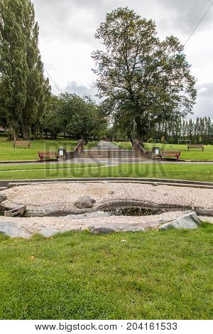 Swadlincote Park Derbyshire water and stone feature. water chanel rock feature with stone and pebble inlays.