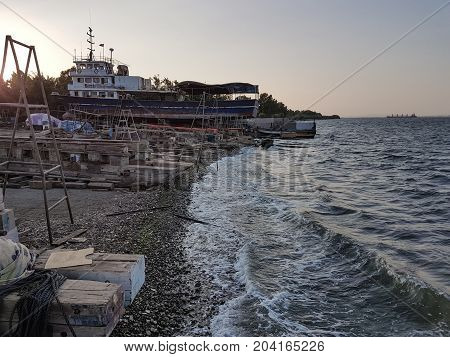 old ships are repaired at docks sunset