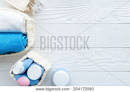 baby organic cosmetic for bath on wooden bakground top view
