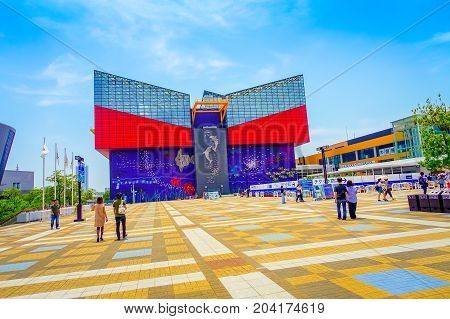 OSAKA, JAPAN - JULY 18, 2017: Unidentified people walking to Aquarium Kaiyukan in Osaka. It is an aquarium located in the ward of Minato in Osaka, Japan, near Osaka Bay.