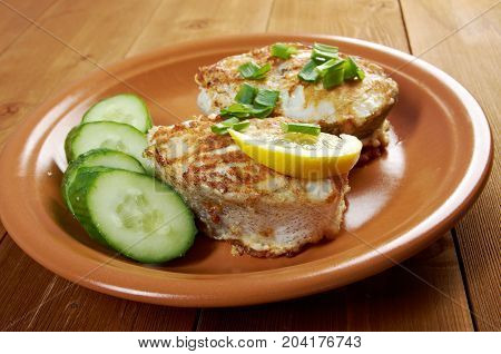 grilled t-bone codfish steak and vegetables ., close up meal