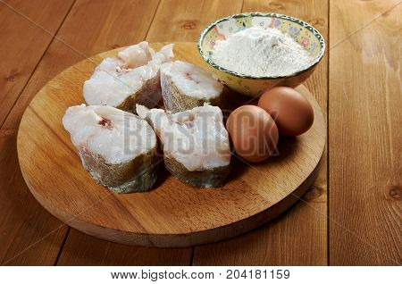 codfish steak .prepared fisheggflour close up traditional meal