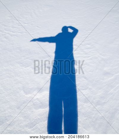 shadow of a man in the snow