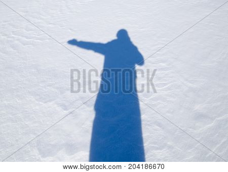 shadow of a man in the snow