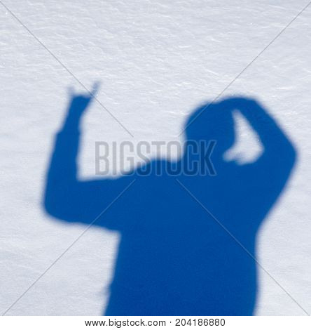 shadow of a man in the snow